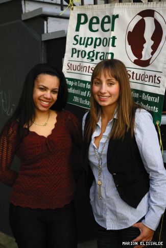 Paola Reyes and Pascale Fainé offer support to other students.